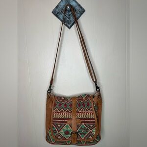 Myra Bag 13 inches wide by 10 inches tall.